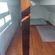 Asymmetrical wall or divider bookcase in dark wood