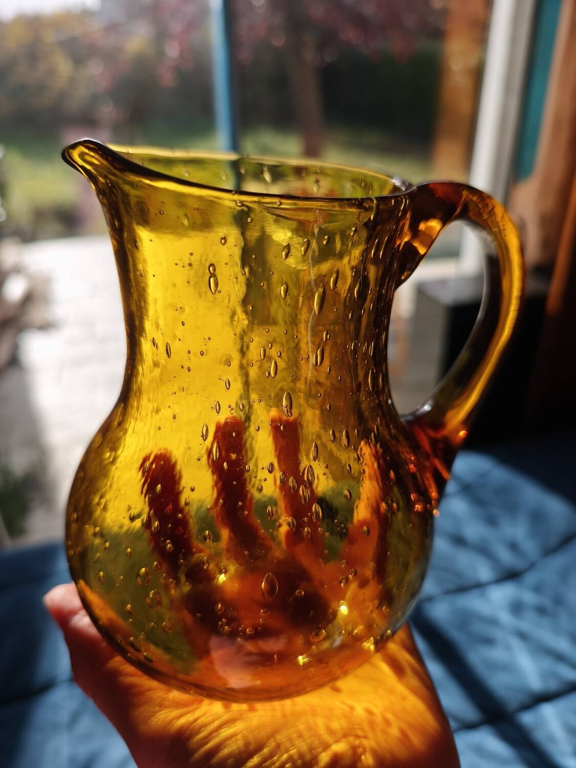 Hand-blown glass pitcher