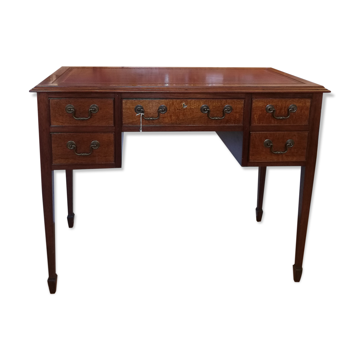 English wooden desk on top of leather