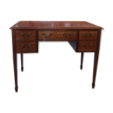 English wooden desk on top of leather