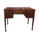 English wooden desk on top of leather