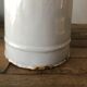 Old pitcher in enamelled sheet metal