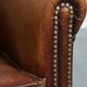 Fauteuil club en cuir de mouton couleur cognac