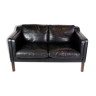 Two-seater sofa upholstered in black leather made by stouby møbelfabrik