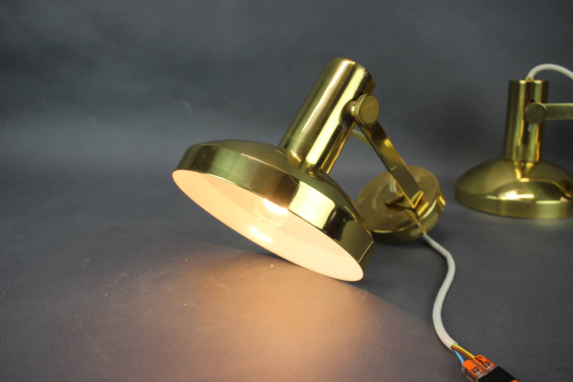 Set of four adjustable brass wall lights, Germany, 1960s.
