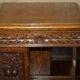 Victorian carved oak revolving library, circa 1880.