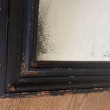 19th century blackened mirror with pitted glass 34cm x 40cm