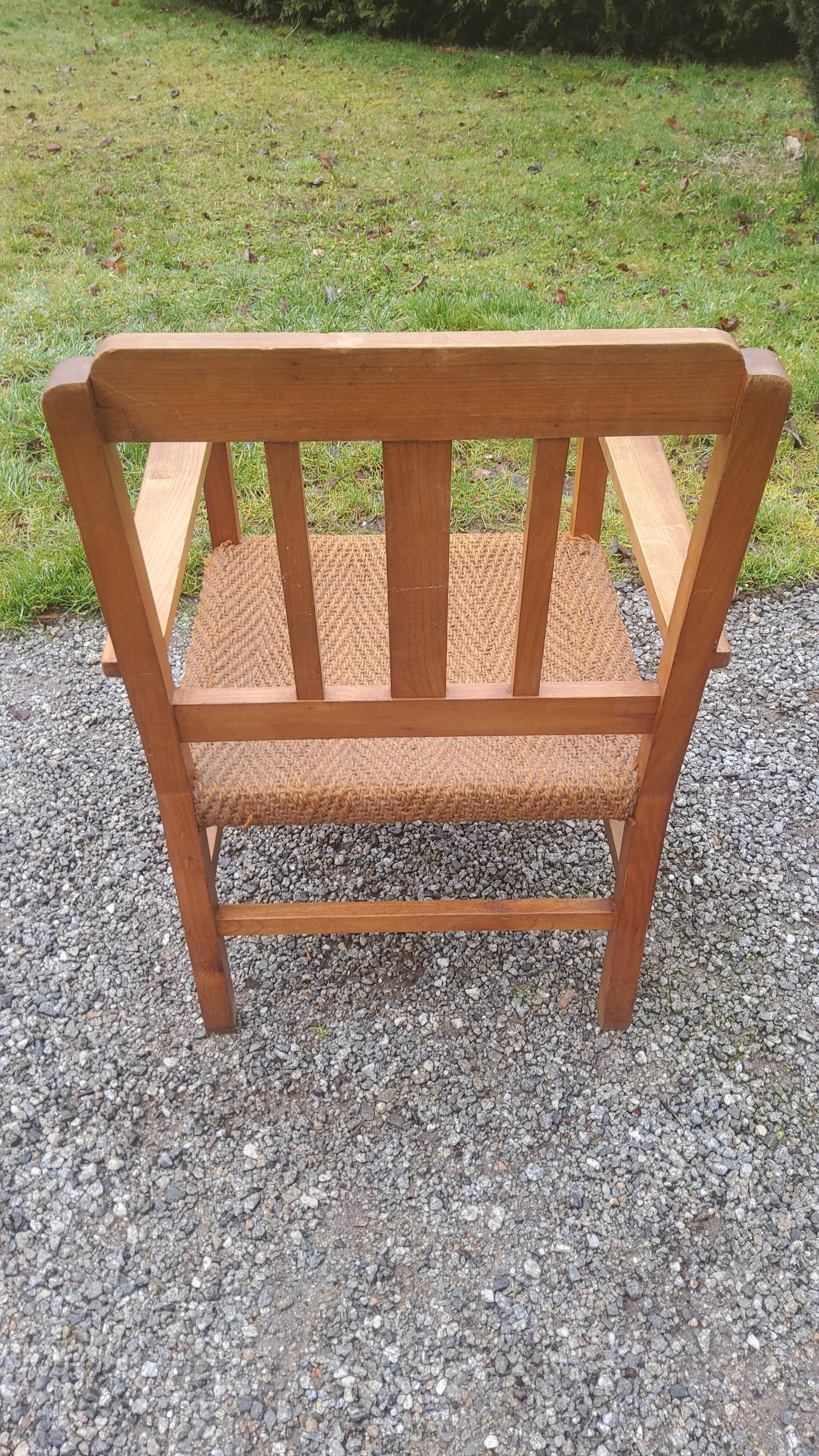 Scandinavian armchair of the 50s in cherry tree sitting in rope