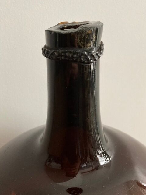 Old amber demijohn