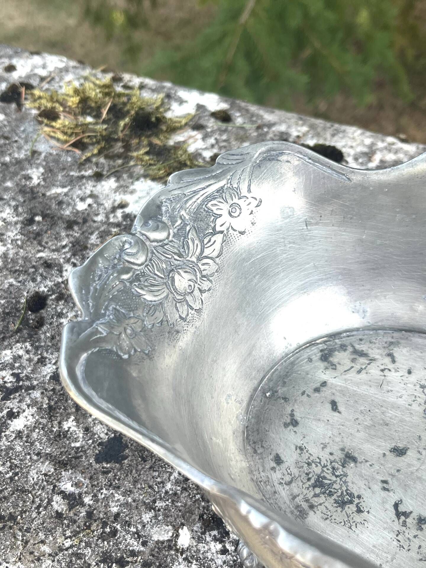 Footed pewter champagne cooler on claw feet with floral relief