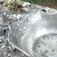 Footed pewter champagne cooler on claw feet with floral relief