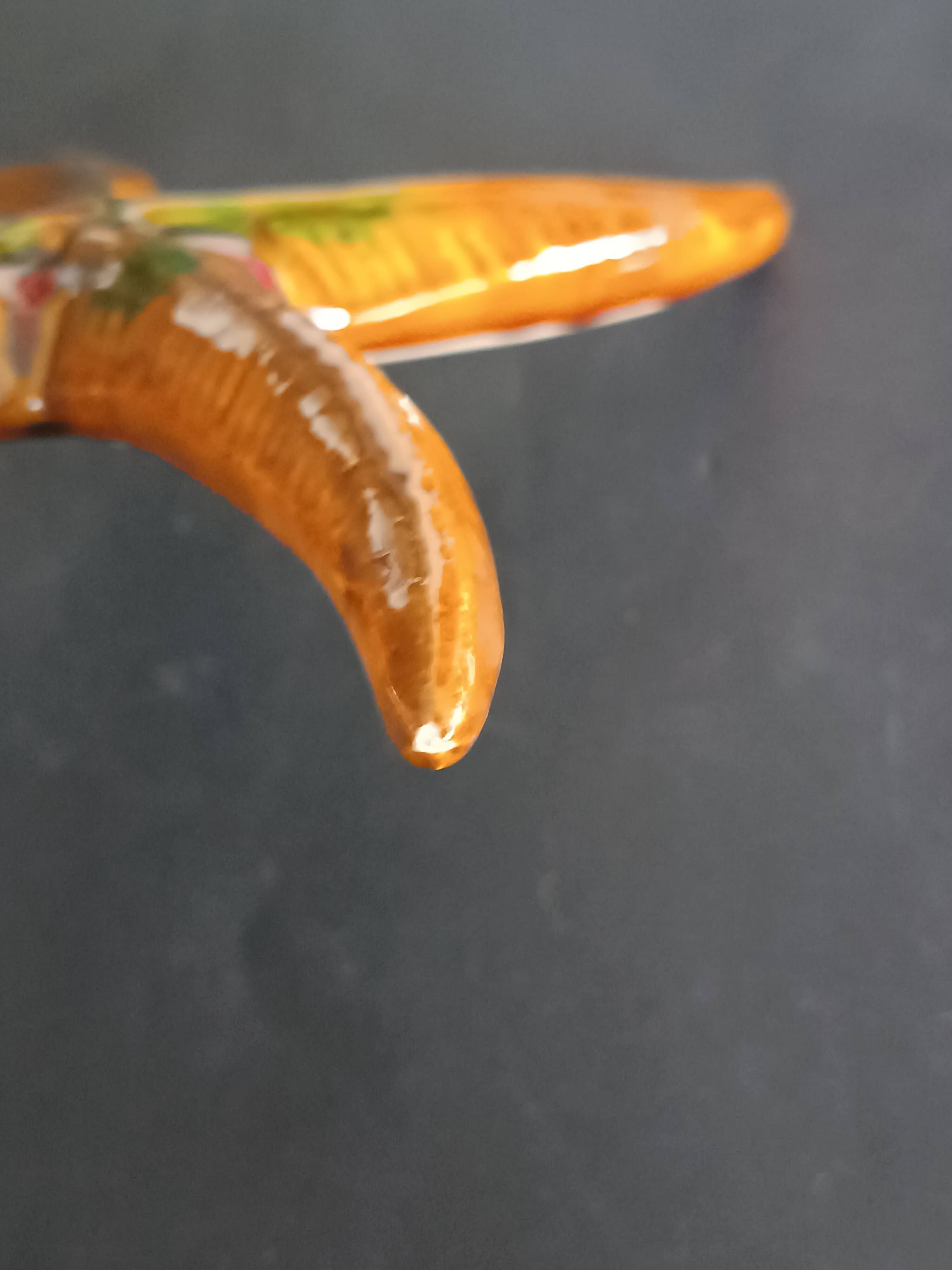 Two vintage ceramic wall pots featuring a seahorse and a starfish.