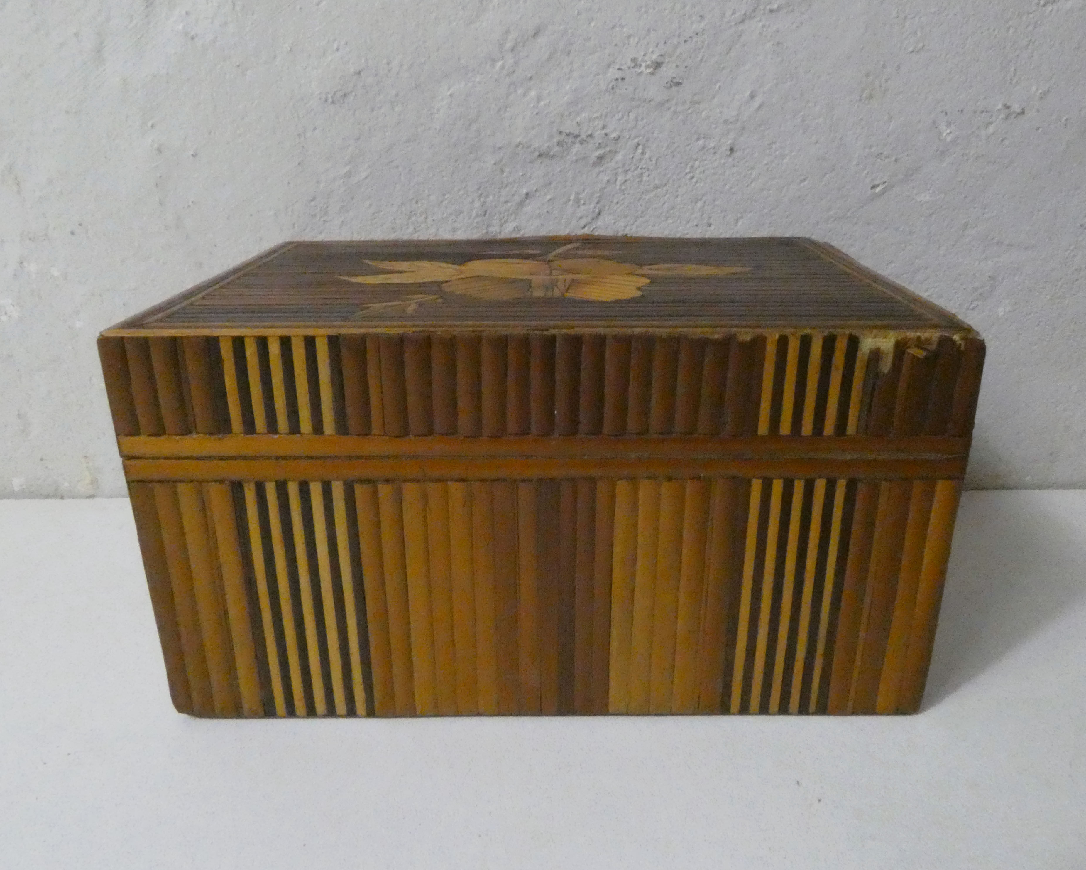 Old trundle boxes in straw marquetry