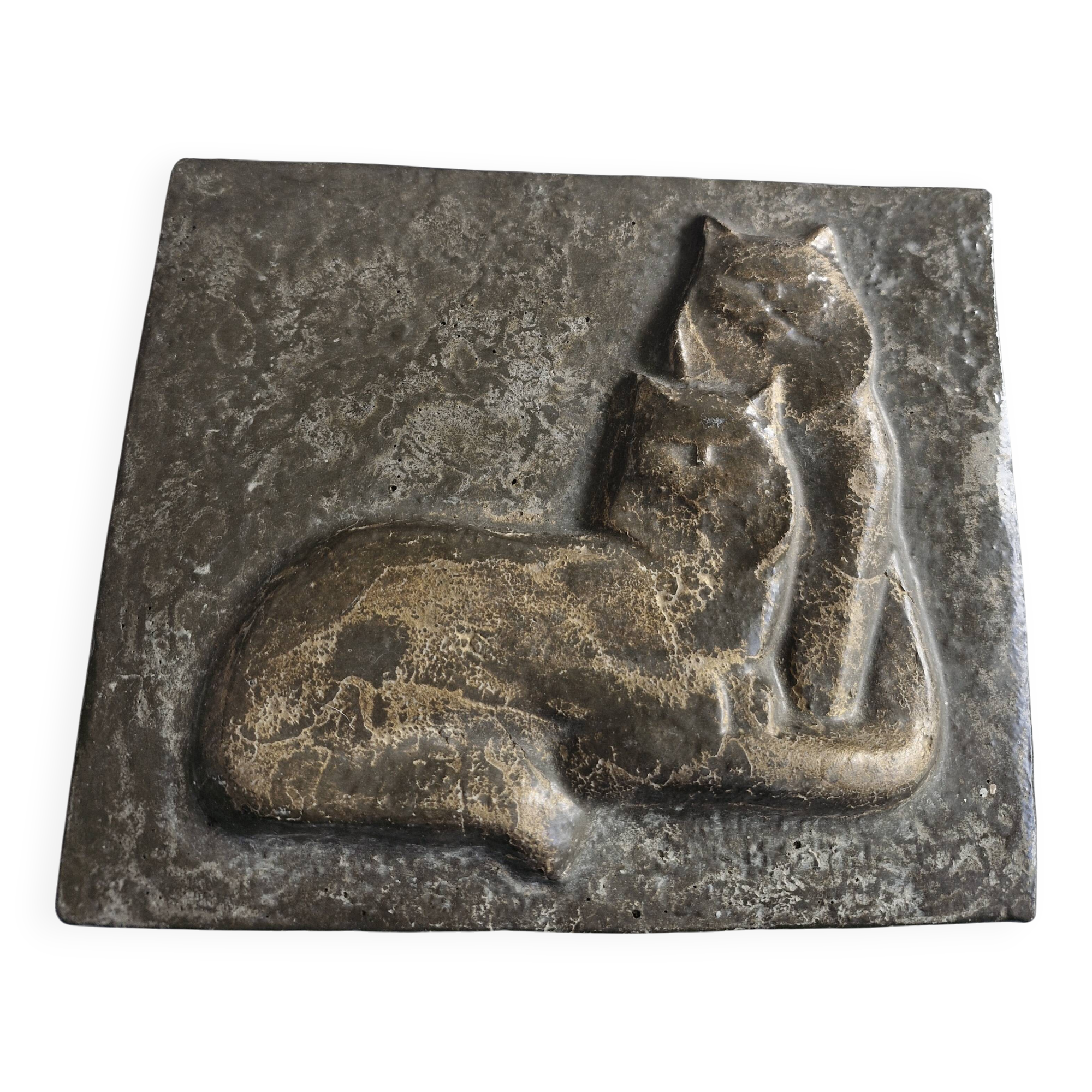 Bas-relief plaque of a rabbit in brown patina, seated cat