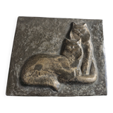 Bas-relief plaque of a rabbit in brown patina, seated cat