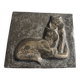 Bas-relief plaque of a rabbit in brown patina, seated cat
