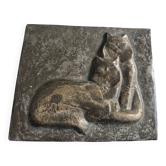 Bas-relief plaque of a rabbit in brown patina, seated cat