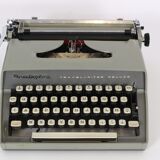 Remington travel-deter Deluxe typewriter with  case