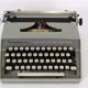 Remington travel-deter Deluxe typewriter with  case