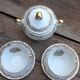 Set of 4 cups and sugar bowl Haute porcelaine de Berry