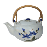Vintage teapot with rattan handle