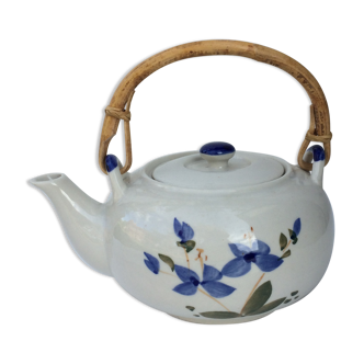 Vintage teapot with rattan handle