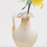 Old decorative carafe in li-colored glass