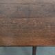 Charming antique English drop-leaf dining table made of oak from the late 19th century