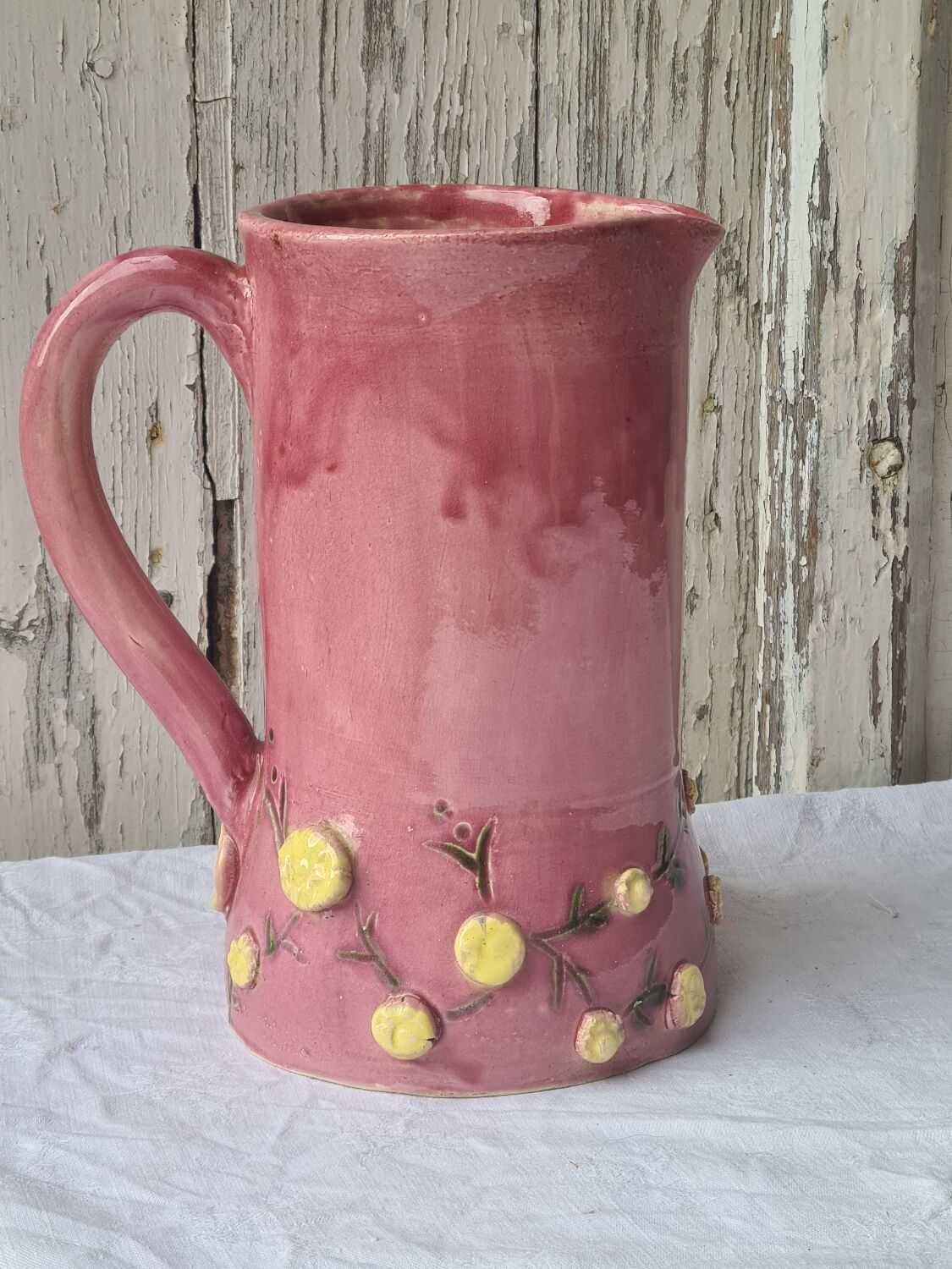Glazed terracotta pitcher with mimosa decoration
