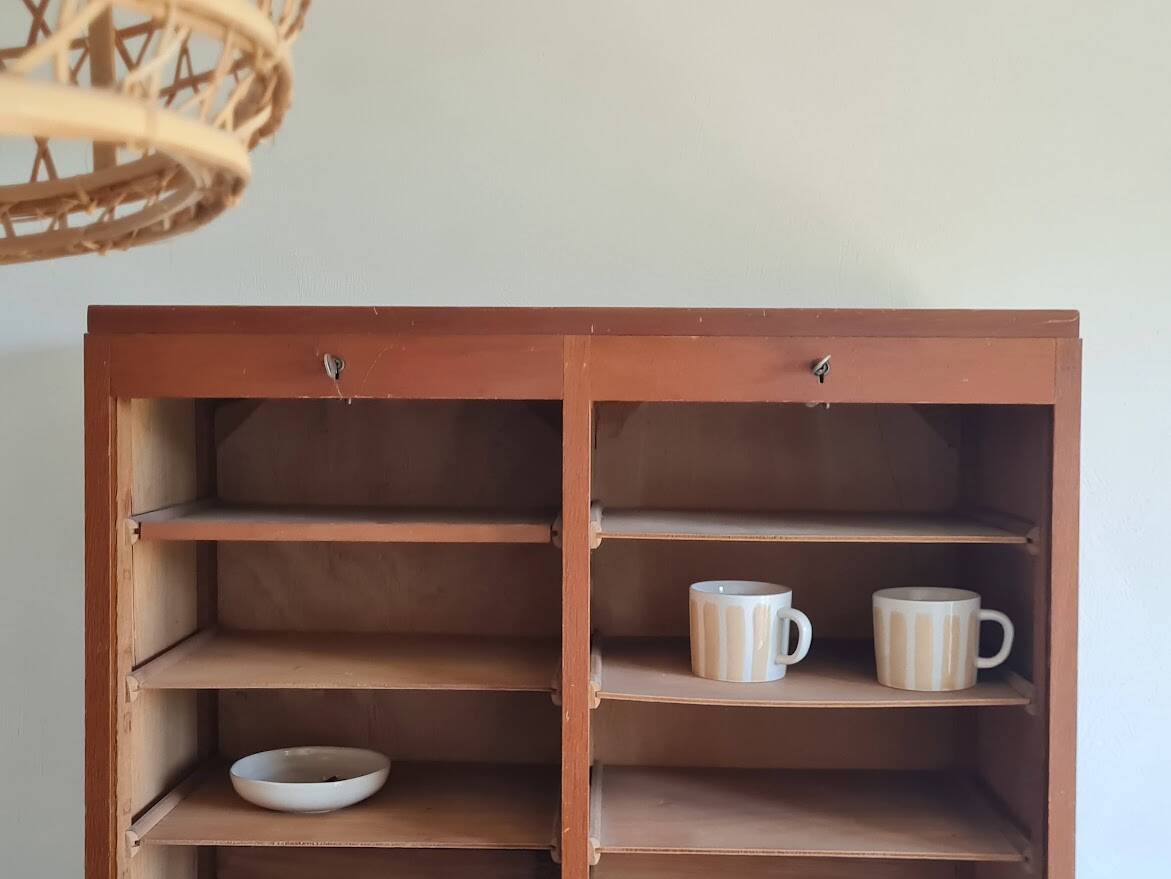 Vintage double curtain filing cabinet.