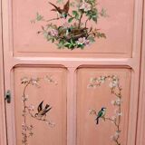 Old pink Parisian cabinet with painted decor
