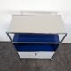 USM Haller furniture in gentian blue and white with a drop-down door on wheels.