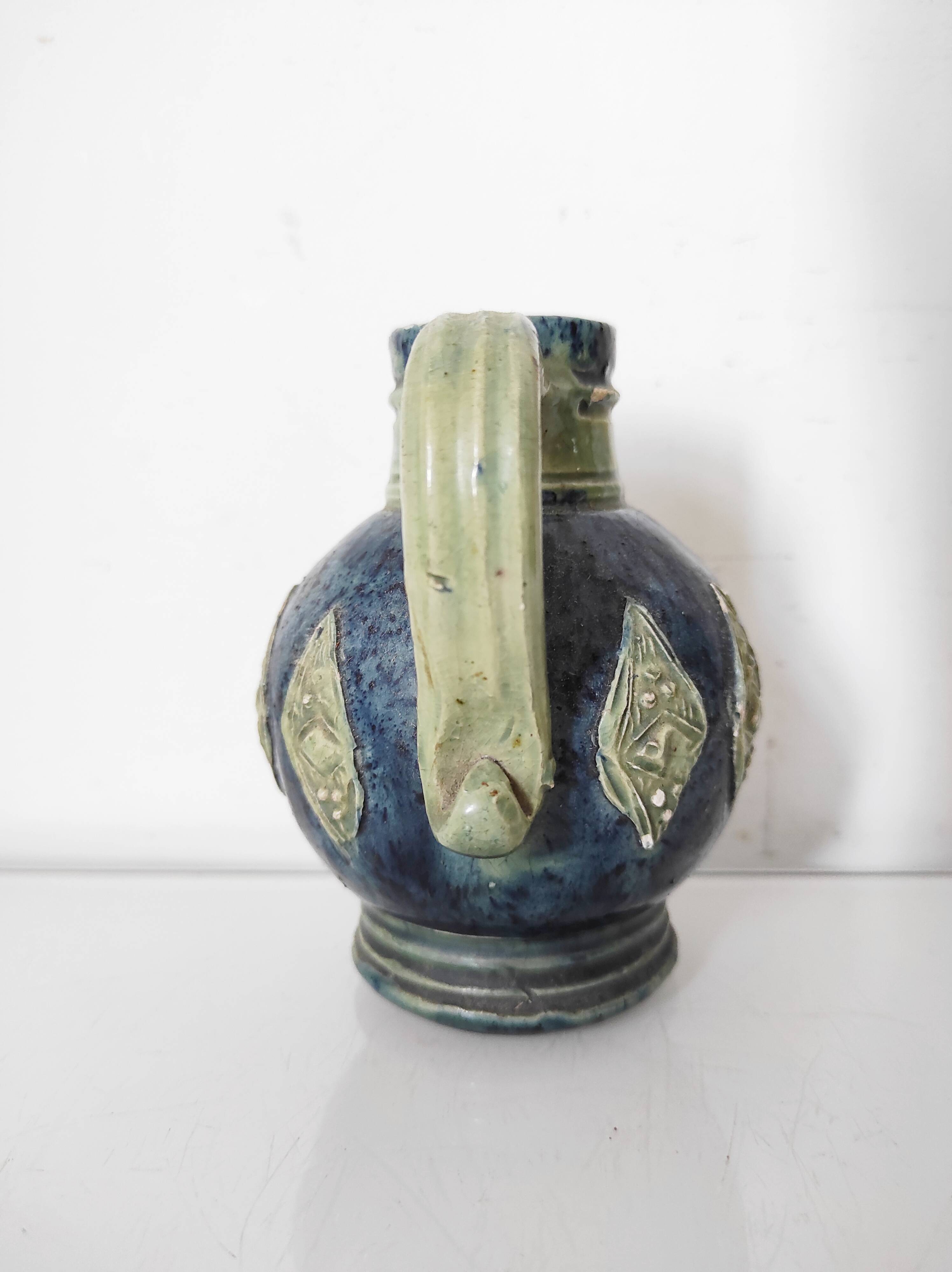 Two small blue ceramic vases