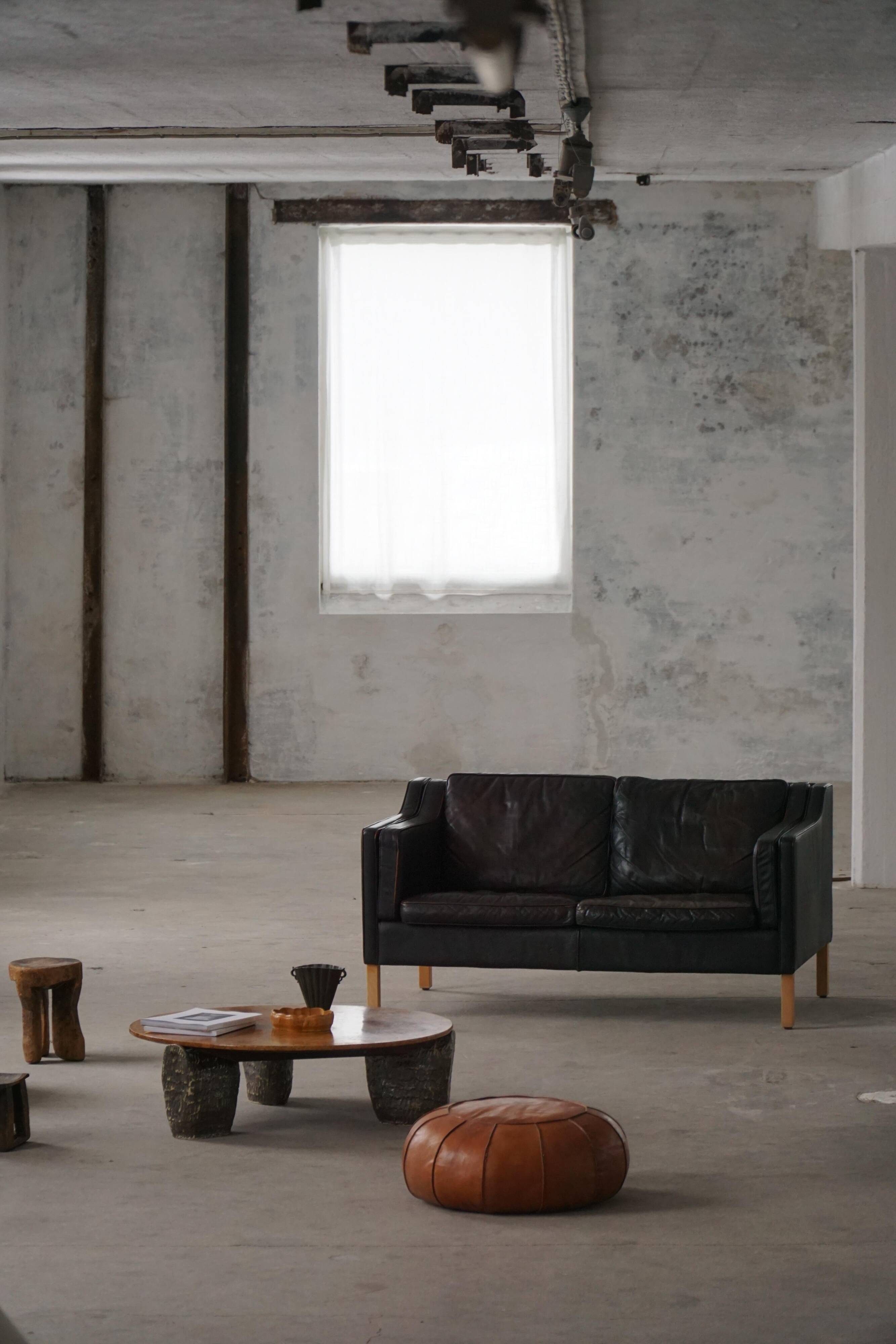Mogens Hansen, mid-century 2-seater sofa, patinated black leather, 1970s.