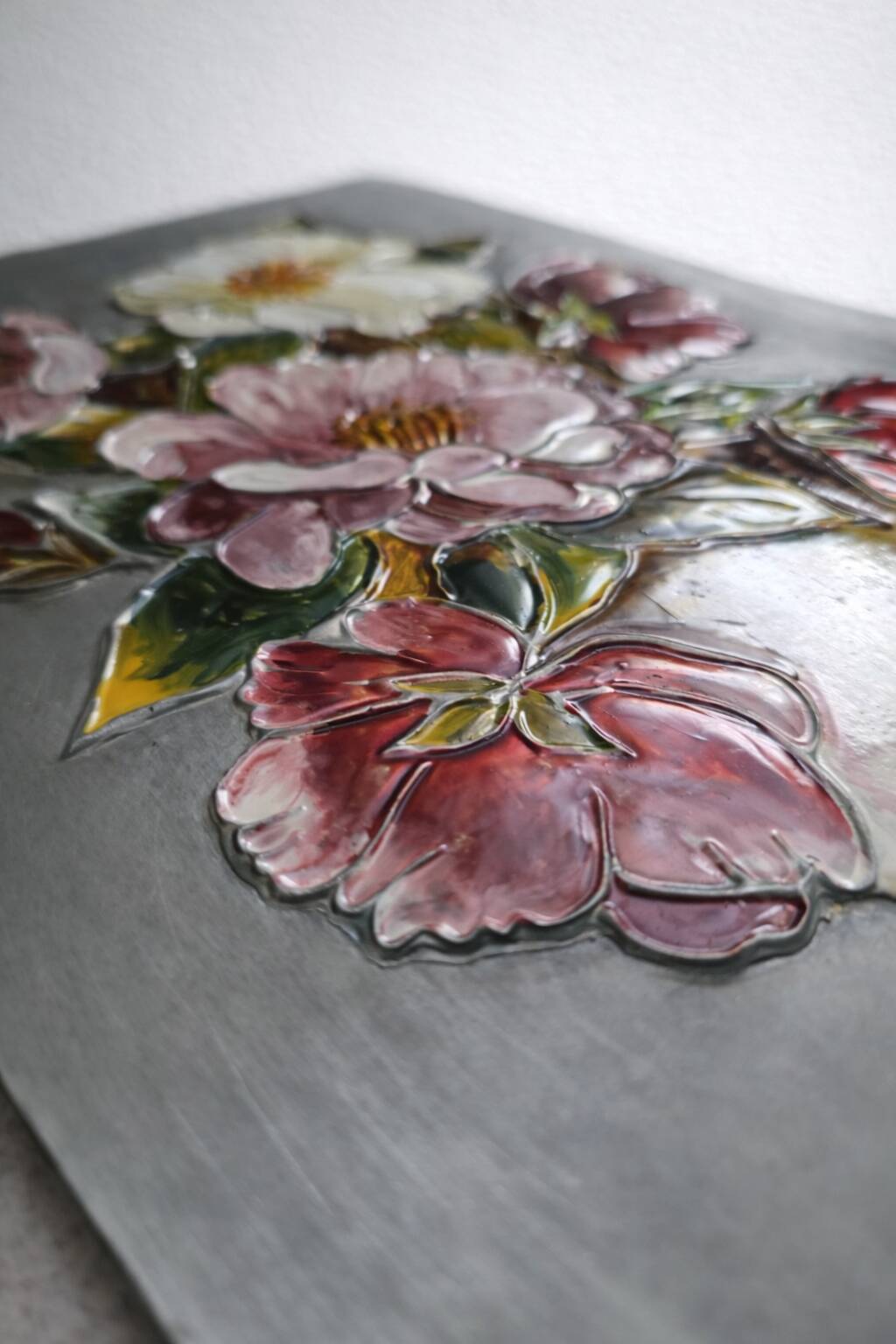 Floral relief panel in genuine tin