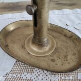 Brass pusher candle holder on oval frame