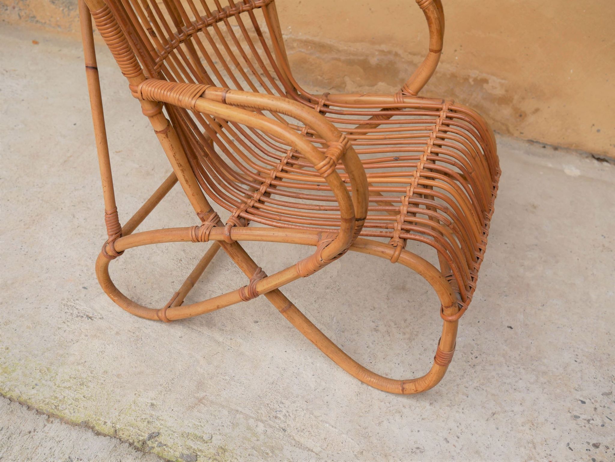 Vintage rattan chair by Louis Sognot
