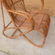 Vintage rattan chair by Louis Sognot