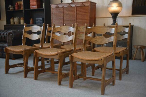 Set of 6 oak dining chairs with rush seat and 'Echelle' backrest in the style of Guillerme et Chambron 1950s