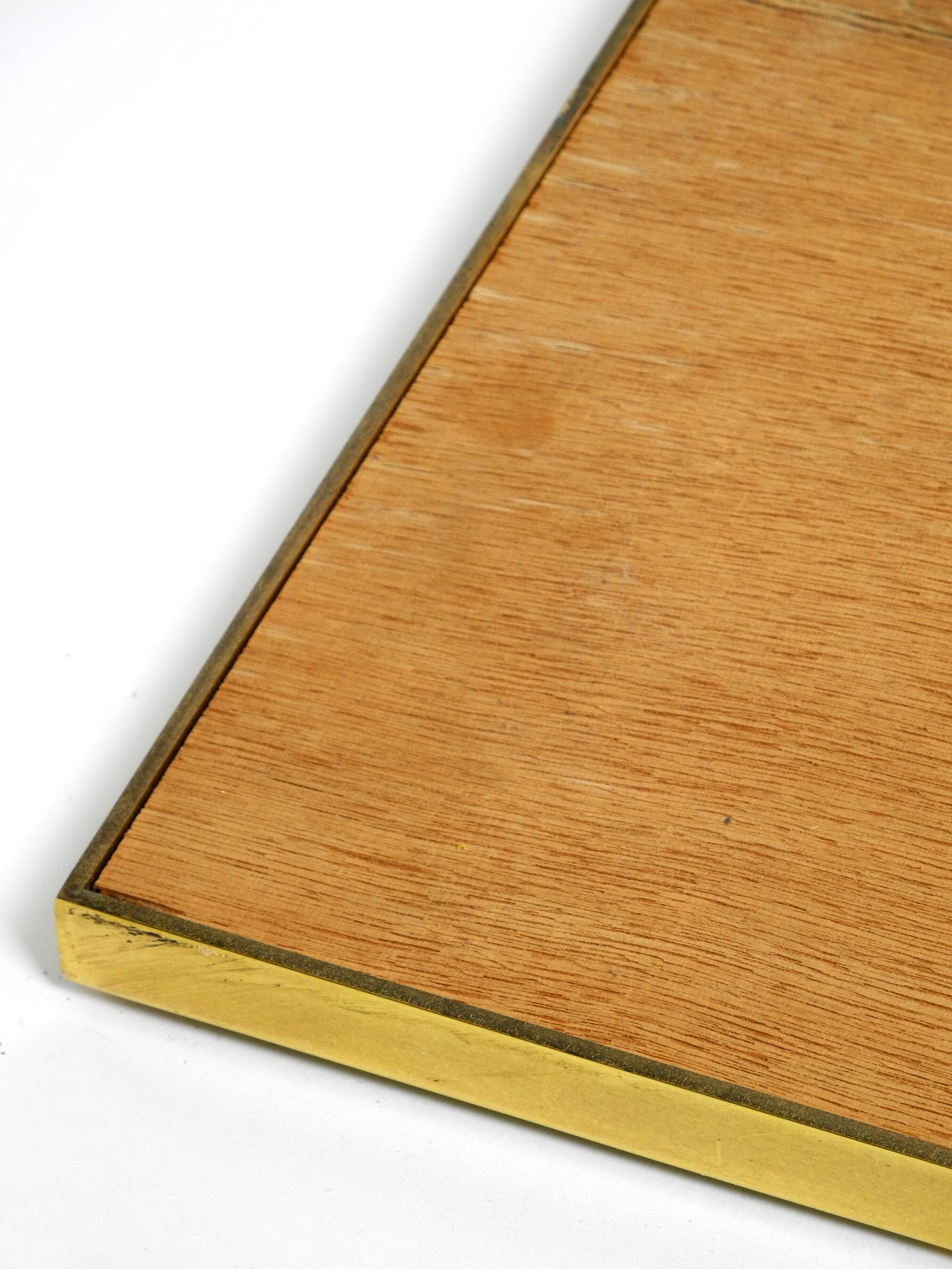 Large, exceptional 1970s brass wall mirror with diagonal mirror strips