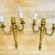Louis XVI bronze wall sconces from the 19th century with quiver decorations.