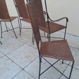 3 chaises et 2 fauteuils en fer forgé et rotin canné, années 50