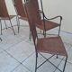 3 chairs and 2 armchairs in wrought iron and caned rattan, 1950s.