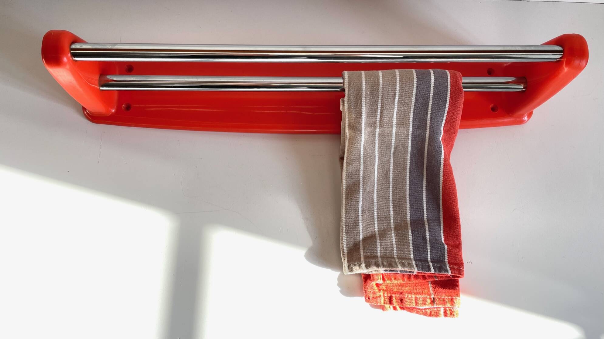 Orange towel rack by Syla from the 70s