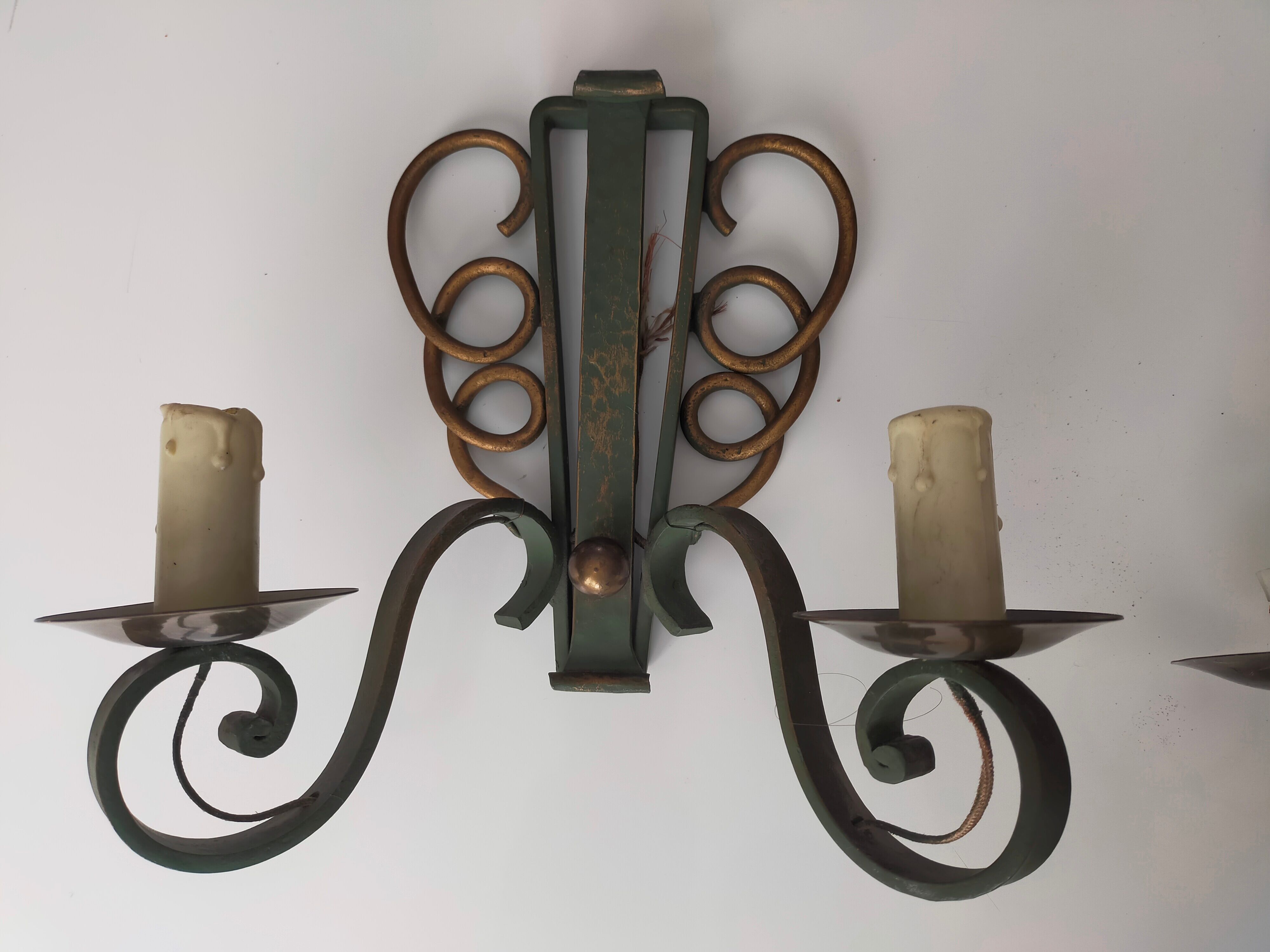 Pairs of vintage wrought iron wall lamps