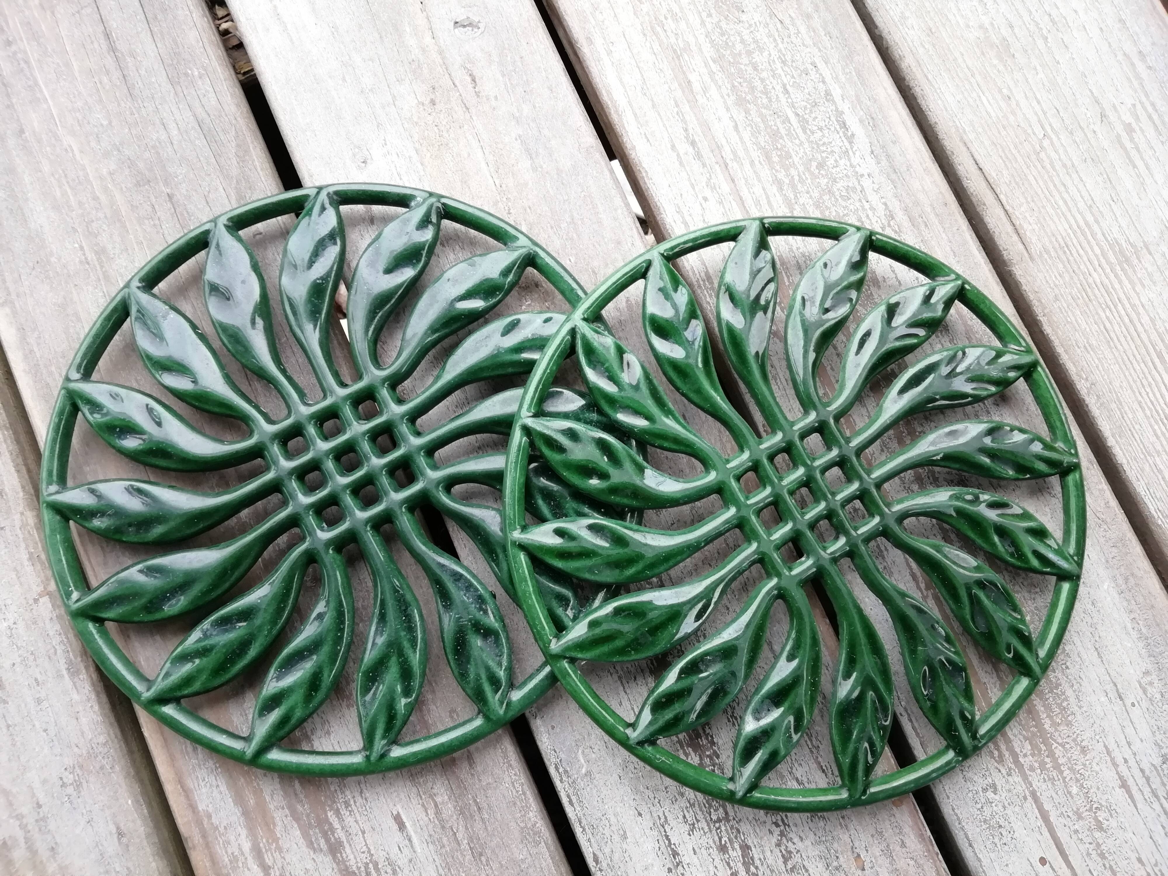 Pair of cast iron table mats