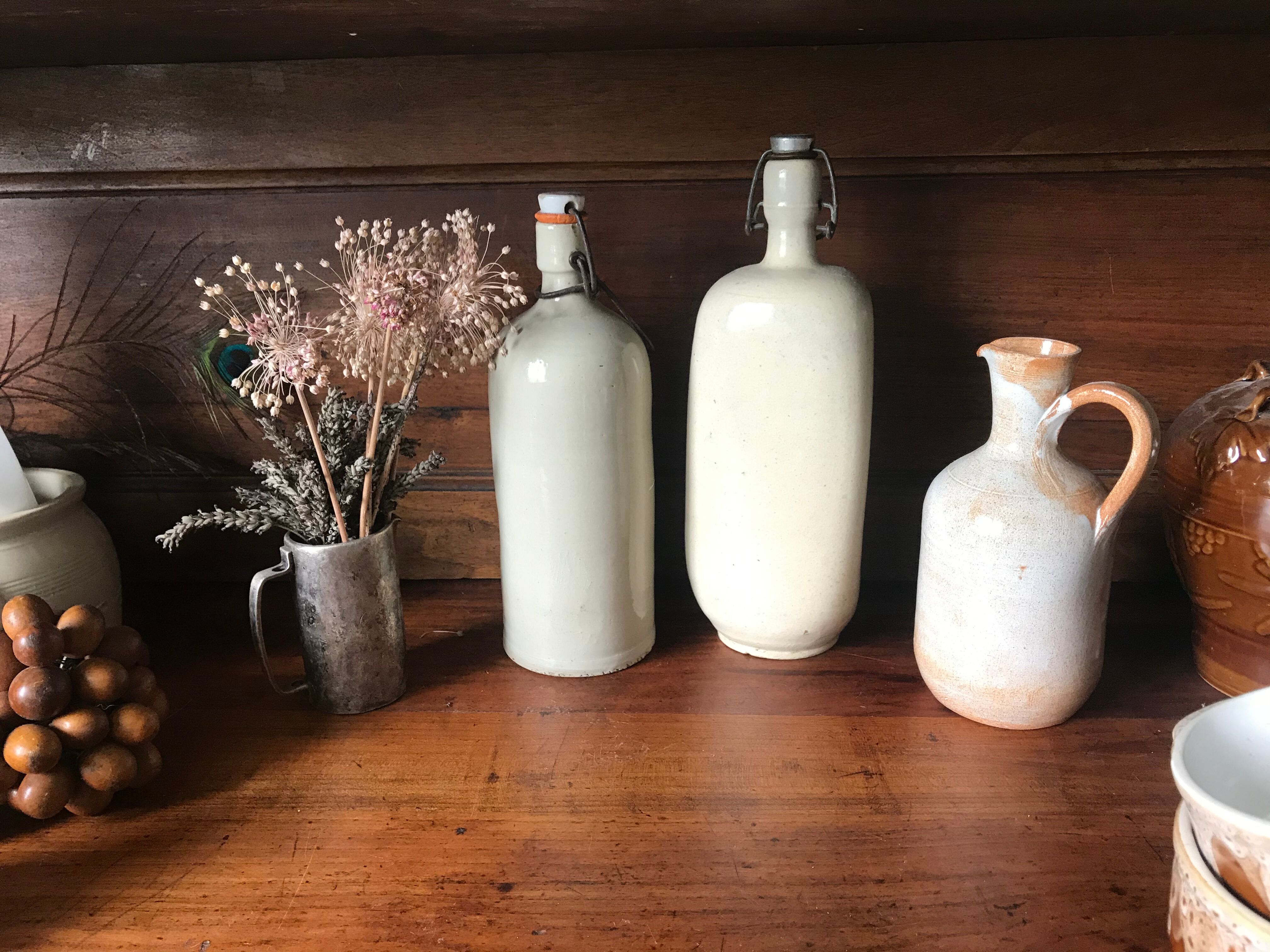 Bottles in varnished sandstone