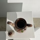 Vintage stoneware teapot with flower and fruit patterns