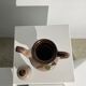 Vintage stoneware teapot with flower and fruit patterns