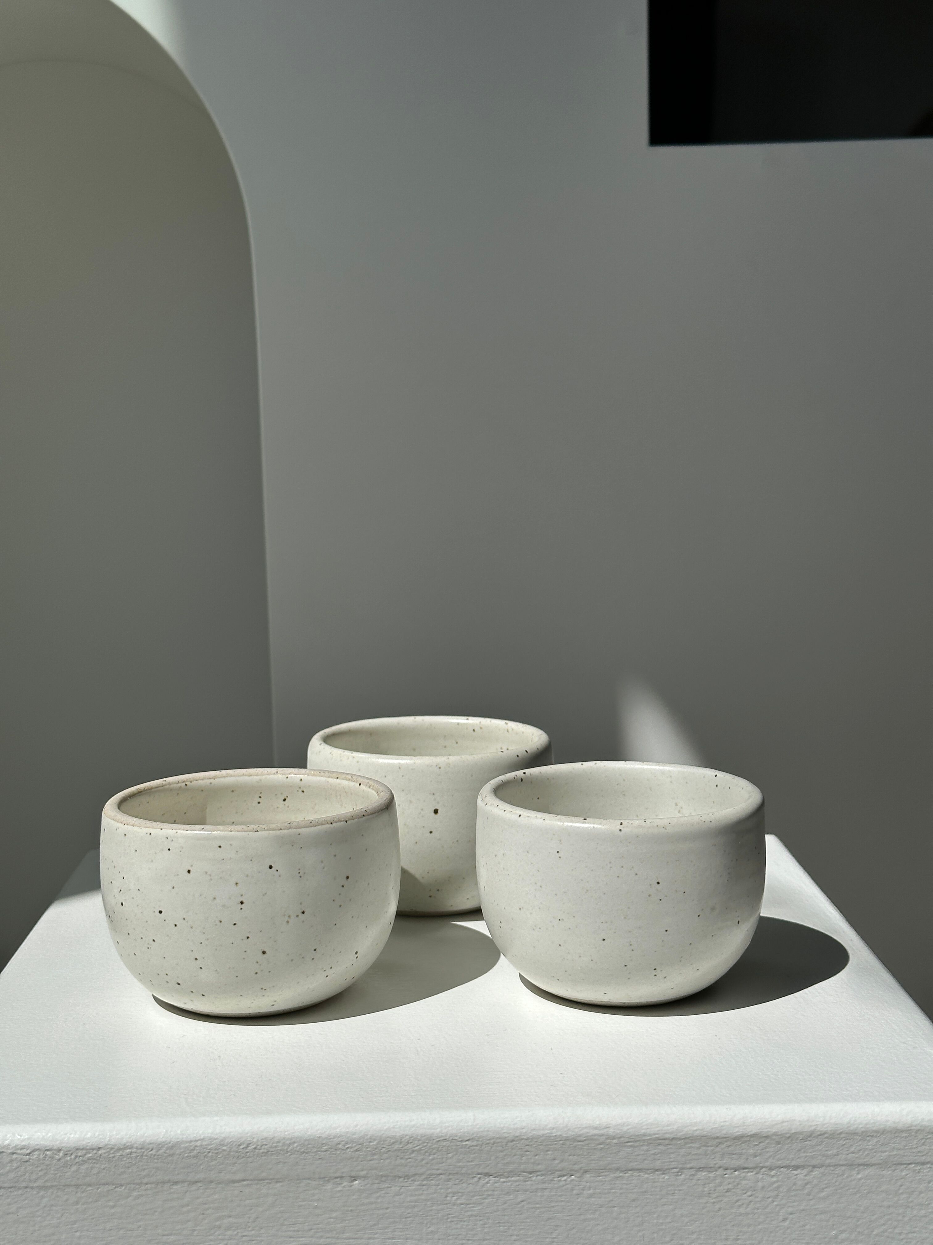 Trio of white ceramic cups D9cm